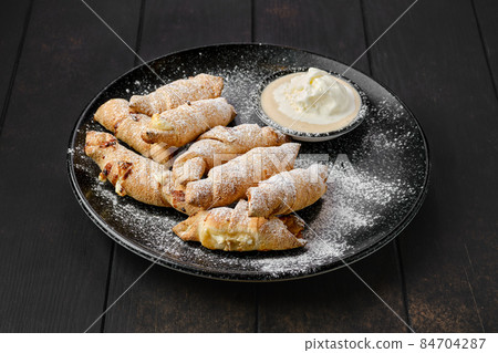 Mini croissant with banana and pear Mini croissant with banana and pear 84704287