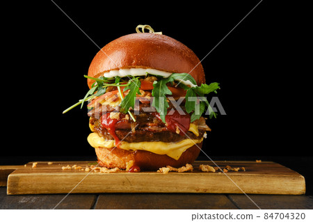 Burger with double beef cutlet and bacon Burger with double beef cutlet and bacon 84704320