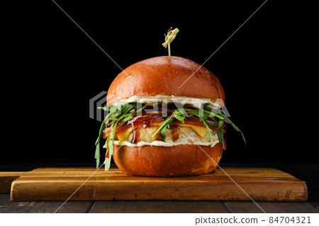 Burger with chicken patty and teriyaki sauce Burger with chicken patty and teriyaki sauce 84704321