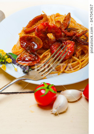 Italian seafood spaghetti pasta on red tomato sauce Italian seafood spaghetti pasta on red tomato sauce 84704367