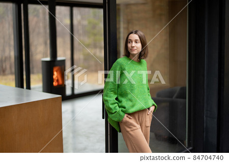 Woman at modern house on nature 84704740