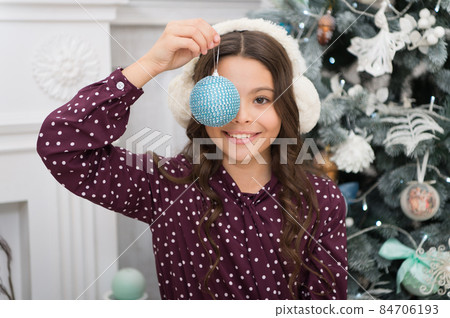 little child girl likes xmas present. Happy new year.  84706193