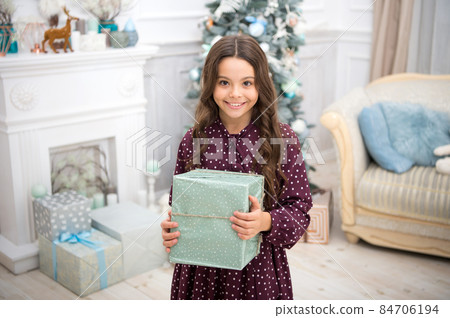 little child girl likes xmas present. Christmas. Kid enjoy little child girl likes xmas present. Christmas. Kid enjoy 84706194
