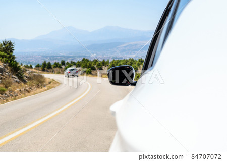 Car on the serpentine mountains road Summer trip vacation. Freedom concept. copy space Car on the serpentine mountains road Summer trip vacation. Freedom concept. copy space 84707072