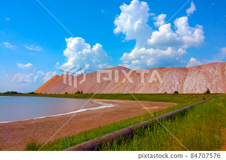 View of the large production mountains of waste ore. Extraction of salt and other minerals. View of the large production mountains of waste ore. Extraction of salt and other minerals. 84707576