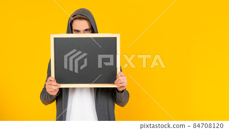 male behind chalkboard. place for useful information. advertisement copy space. 84708120