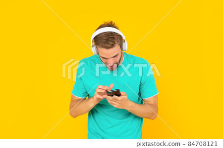Start chatting now. Guy listening to music chatting on smartphone. Mobile chat. Using messaging app 84708121