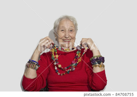 Senior woman and jewelry pearl Senior woman and jewelry pearl 84708755