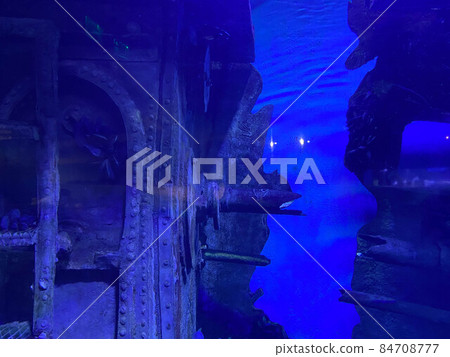 An underwater shot inside a room in the shipwreck of the Kittiwake that uses natural light as opposed to a strobe. The wreck has been sunk deliberately and is shallow enough to allow light penetration 84708777
