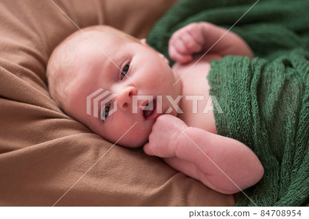 Baby boy posing for his first portrait 84708954