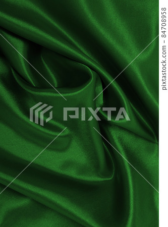 Smooth elegant green silk or satin luxury cloth texture as abstract background. Luxurious background design Smooth elegant green silk or satin luxury cloth texture as abstract background. Luxurious background design 84708958