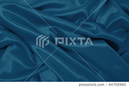Smooth elegant blue silk or satin luxury cloth texture as abstract background. Luxurious Christmas background or New Year background design Smooth elegant blue silk or satin luxury cloth texture as abstract background. Luxurious Christmas background or New Year background design 84708960