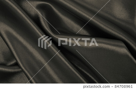 Smooth elegant brown silk or satin luxury cloth texture as abstract background. Luxurious background design wallpaper. In Sepia toned. Retro style Smooth elegant brown silk or satin luxury cloth texture as abstract background. Luxurious background design wallpaper. In Sepia toned. Retro style 84708961