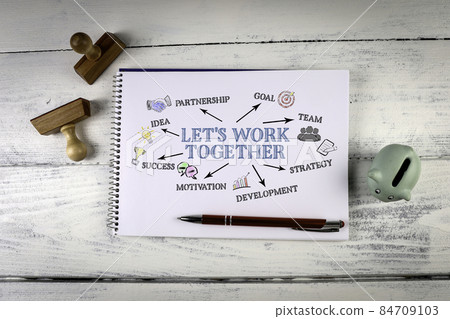 Let's work together. Notebook on a white wooden office desk 84709103