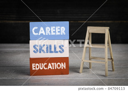 Career, Skills an Education concept. Colored wooden blocks in a pile and stairs Career, Skills an Education concept. Colored wooden blocks in a pile and stairs 84709113