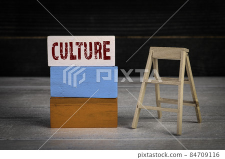 Culture. Development and success concept. Colored wooden blocks in a pile and stairs Culture. Development and success concept. Colored wooden blocks in a pile and stairs 84709116