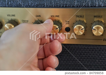 Guitar amplifier closeup, cable connected Guitar amplifier closeup, cable connected 84709858