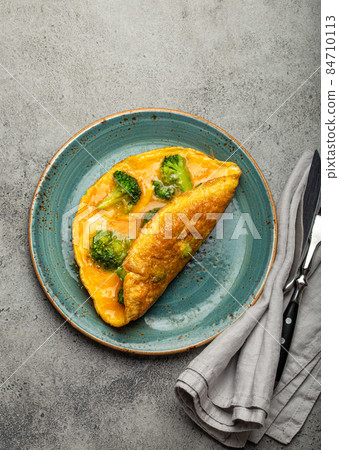 Healthy omelette with broccoli on plate top view 84710113