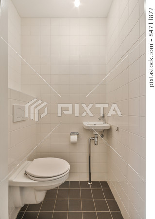 Interior of small clean restroom in miniature style 84711872