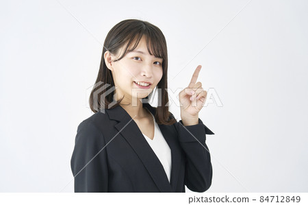 Business woman pointing white background Business woman pointing white background 84712849