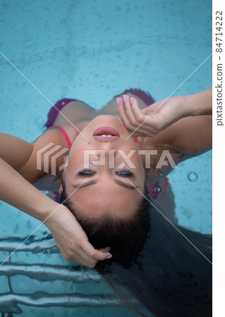 Sexy female relaxing in clean water 84714222