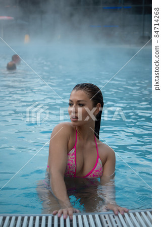 Sensual female in hot pool 84714268
