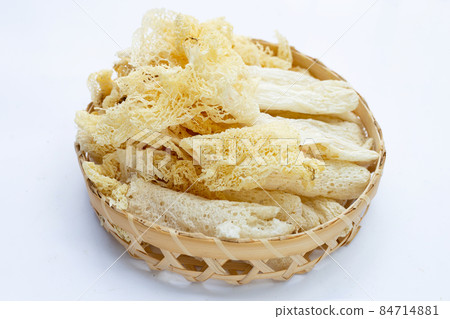 Dried tropical stinkhorn mushroom in bamboo basket 84714881