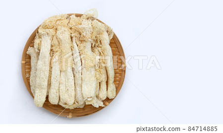 Dried tropical stinkhorn mushroom in bamboo basket 84714885