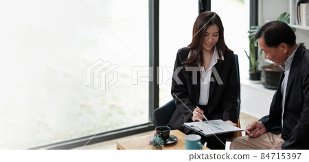 Senior asian man meeting financial adviser for investment, Financial advisor talks with client for financial planning after retirement 84715397