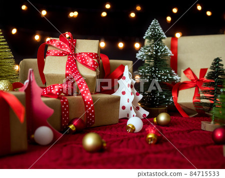 Christmas and New Year concept. Beautiful presents and decorations with bokeh lights background Christmas and New Year concept. Beautiful presents and decorations with bokeh lights background 84715533