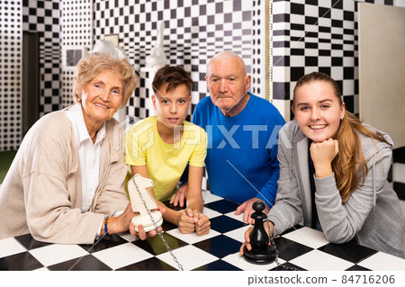 Grandkids and grandparents in escape room 84716206