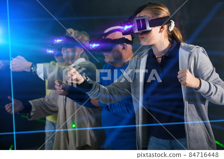 Girl in VR headset playing games with his family 84716448