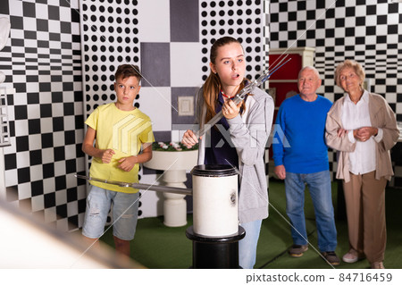 Kids and grandparents in escape room 84716459