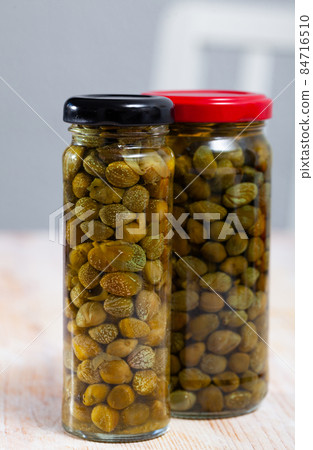 Canned capers in glass jar Canned capers in glass jar 84716510