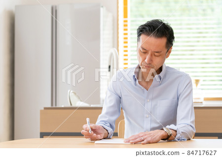 Middle man writing a letter Middle man writing a letter 84717627