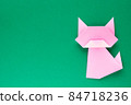 Pink origami cat on green background 84718236