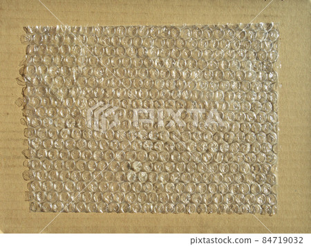 On corrugated cardboard paper plastic air bubble protection foil wrap texture background On corrugated cardboard paper plastic air bubble protection foil wrap texture background 84719032