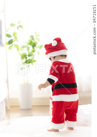 Boy in Santa's costume Boy in Santa's costume 84719251