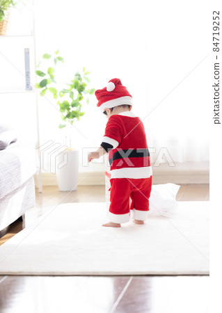 Boy in Santa's costume Boy in Santa's costume 84719252