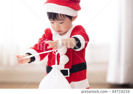 Boy in Santa's costume 84719256