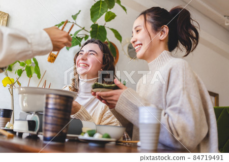 Young people having a home party 84719491