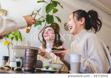 Young people having a home party 84719492