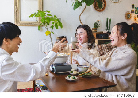 Young people having a home party 84719668