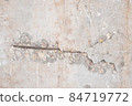 Textured grunge Beige pink background. Old wall with a peeling cover 84719772