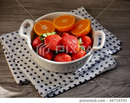 Fresh organic fruits strawberries and tangerines Fresh organic fruits strawberries and tangerines 84719793