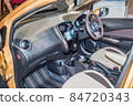 The driver's seat of a compact car. Handles and seats 84720343