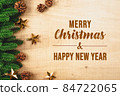 Christmas ball and pine tree with xmas decoration on wooden back 84722065