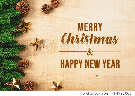 Christmas ball and pine tree with xmas decoration on wooden back Christmas ball and pine tree with xmas decoration on wooden back 84722065