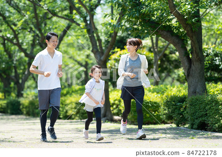 Young parents and children jogging Young parents and children jogging 84722178