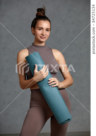 pregnancy, yoga, people and healthy lifestyle concept - happy pregnant woman meditating at home 84725134